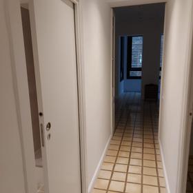 Corridor with a pocket door sliding into the partition